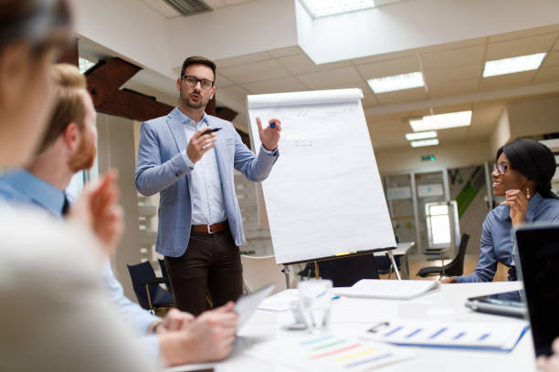 Businessman is presenting new project to partners in the office.